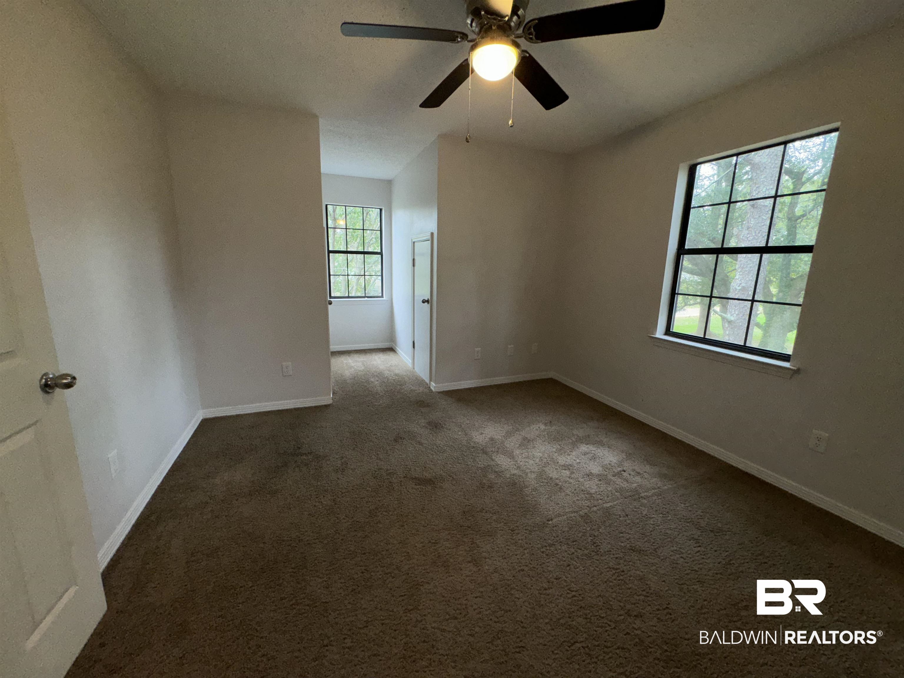 70 Plum Street Uriah, AL 36480 - Photo 20 of 36 Carpeted empty room with ceiling fan