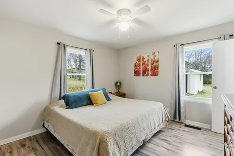 a bedroom with a large bed and a window