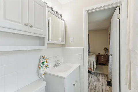 a bathroom with a sink a toilet and tub