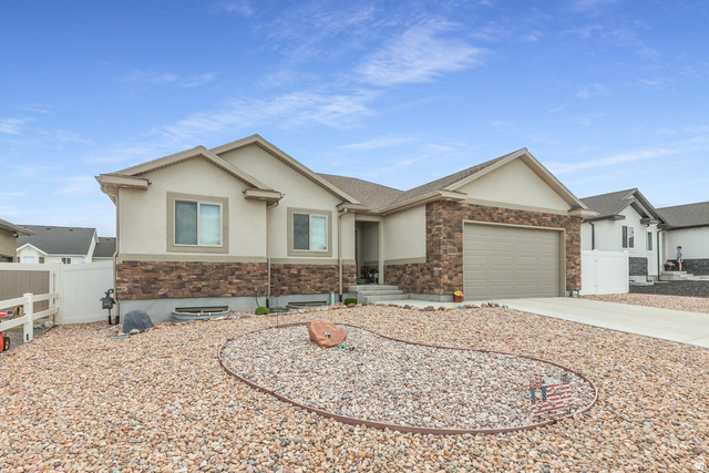 1228 North Providence Way Tooele, UT 84074 - Photo 2 of 28 Single-story residence featuring a stucco and stone veneer exterior