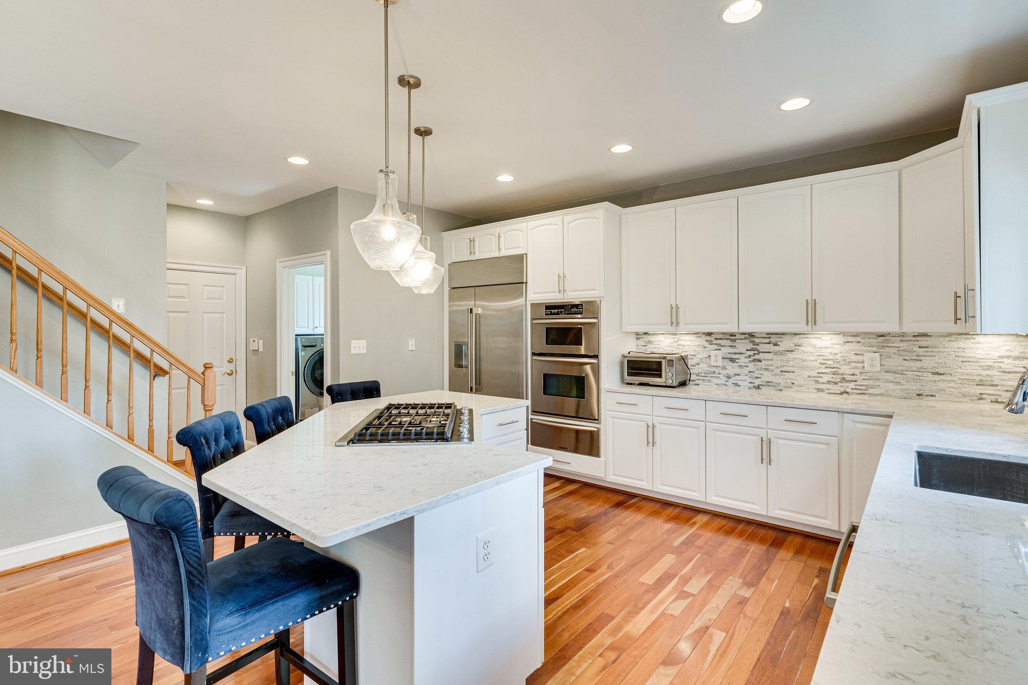 6825 Williamsburg Boulevard Arlington, VA 22213 - Photo 5 of 55 Quartz island with gas cooktop