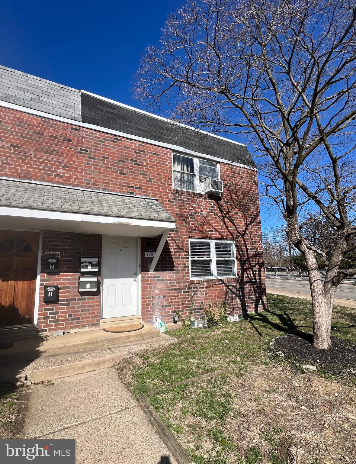 7201 Devon Street, Unit 1 Philadelphia, PA 19119 - Photo 2 of 13 a front view of a house with garden