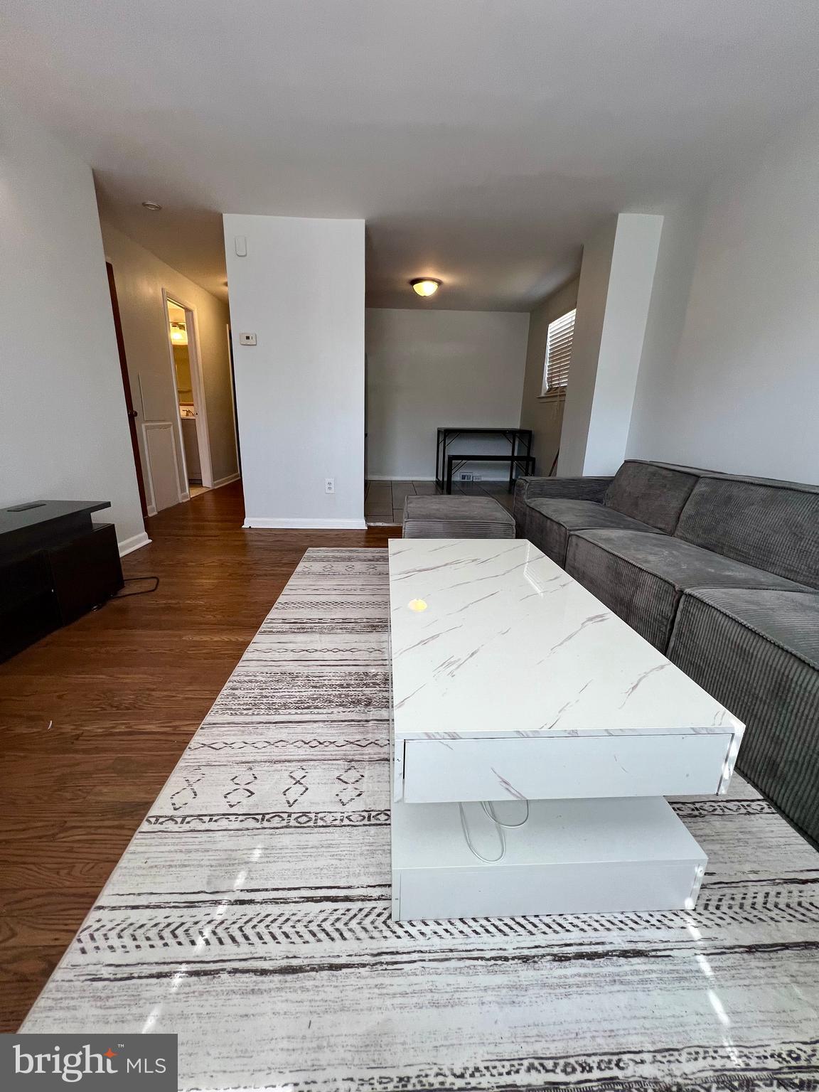 7201 Devon Street, Unit 1 Philadelphia, PA 19119 - Photo 4 of 13 a large white room with a rug
