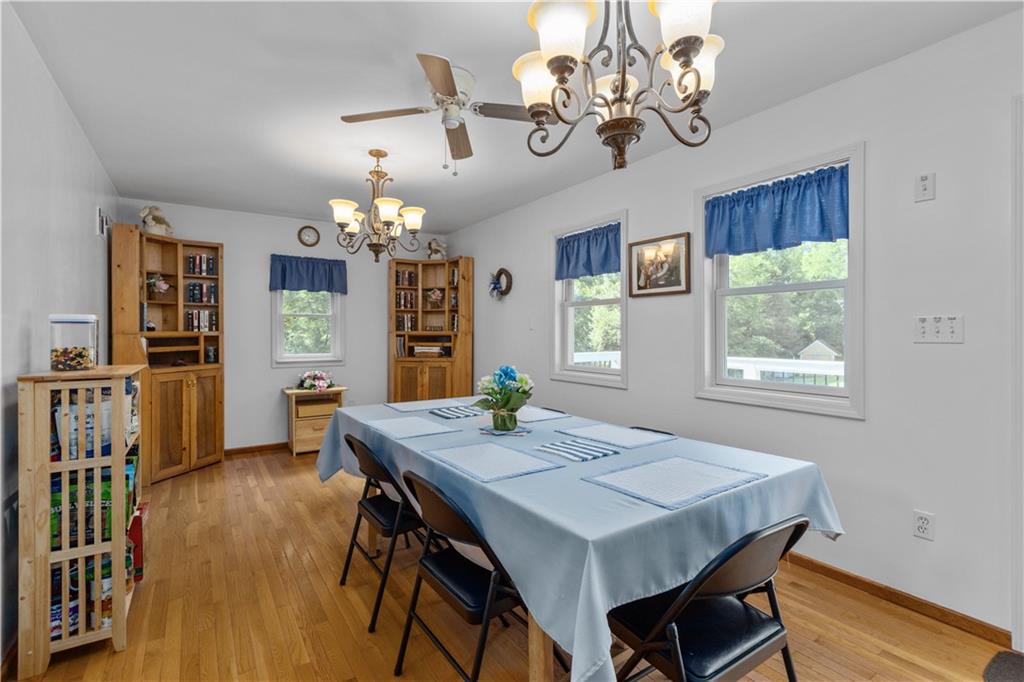 253 Karch Road Burgettstown, PA 15021 - Photo 14 of 25 a view of a dining room with furniture a chandelier and wooden floor