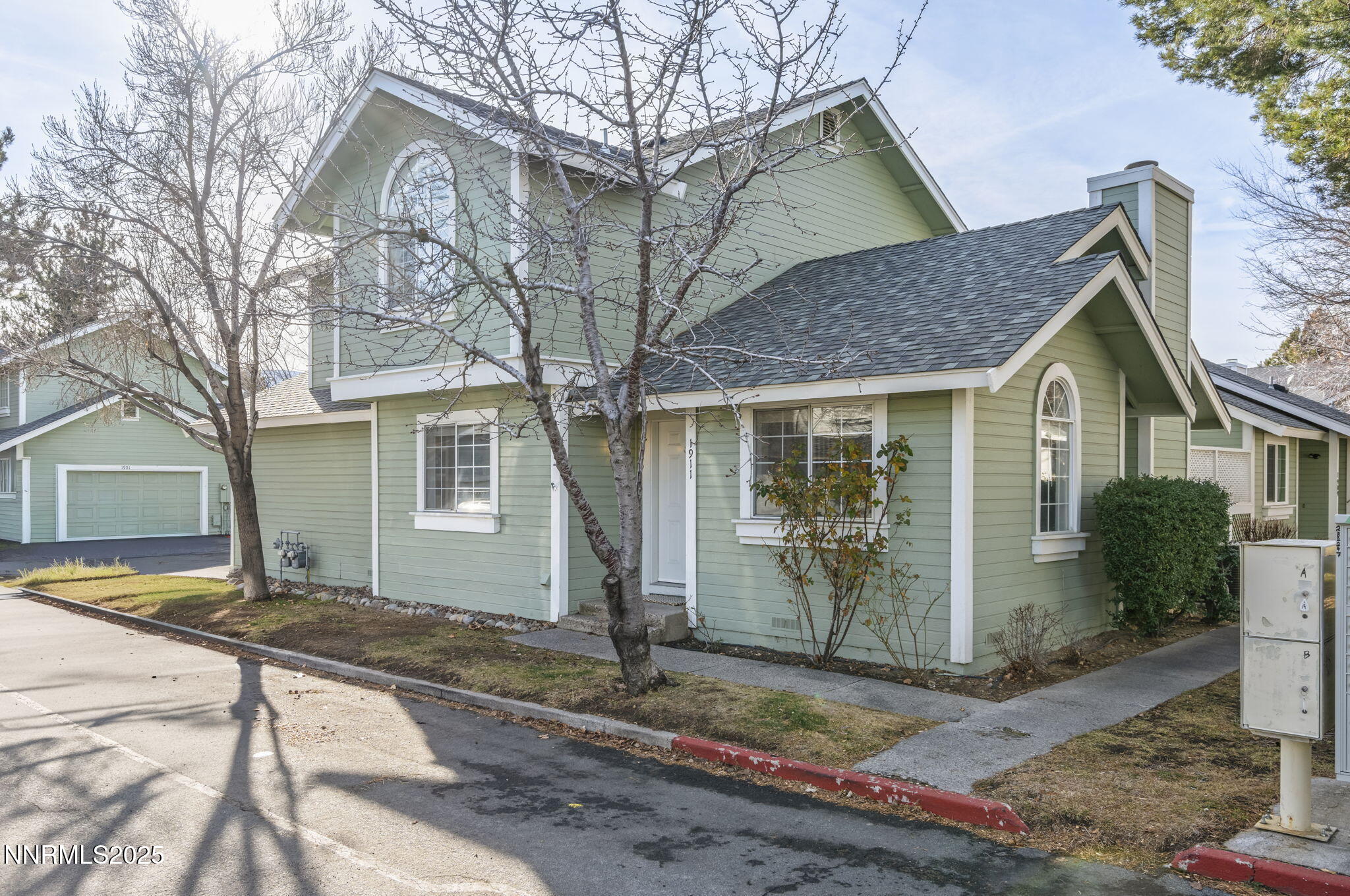 1911 East Minaret Circle Reno, NV 89523 - Photo 1 of 27 a front view of a house with garden