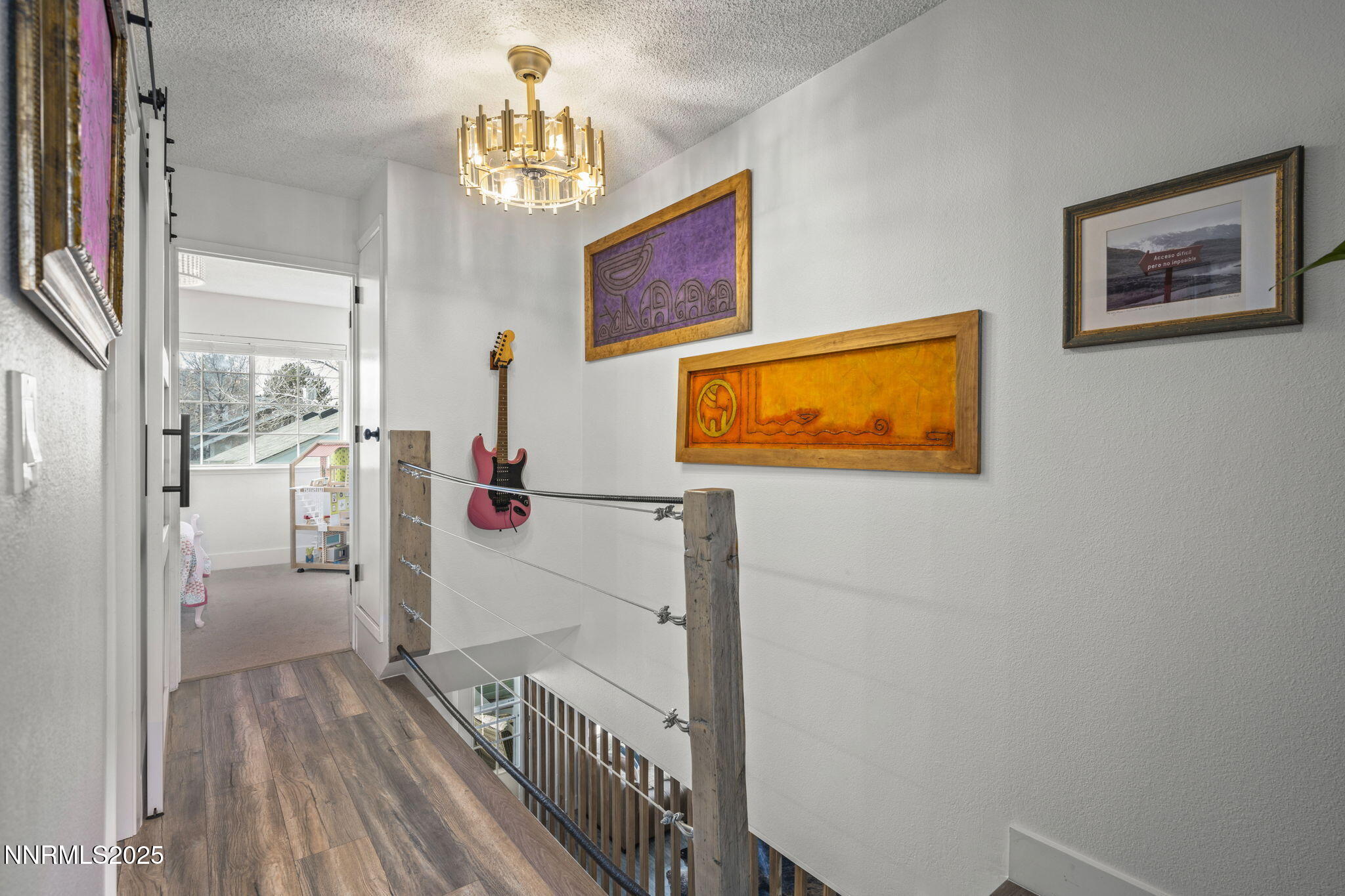 1911 East Minaret Circle Reno, NV 89523 - Photo 12 of 27 a view of a hallway with paintings on the wall
