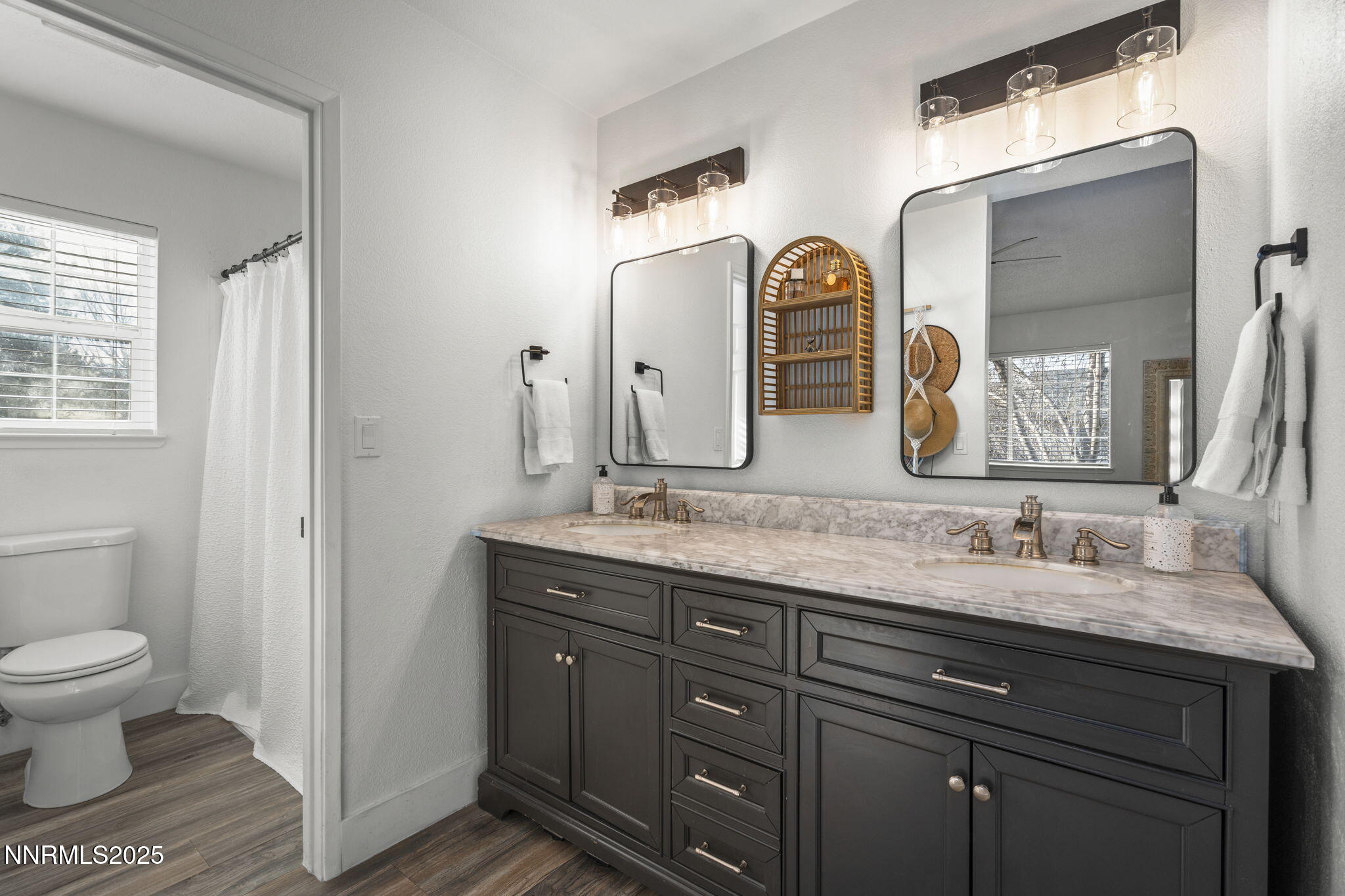 1911 East Minaret Circle Reno, NV 89523 - Photo 18 of 27 a bathroom with double vanity sinks and a mirror