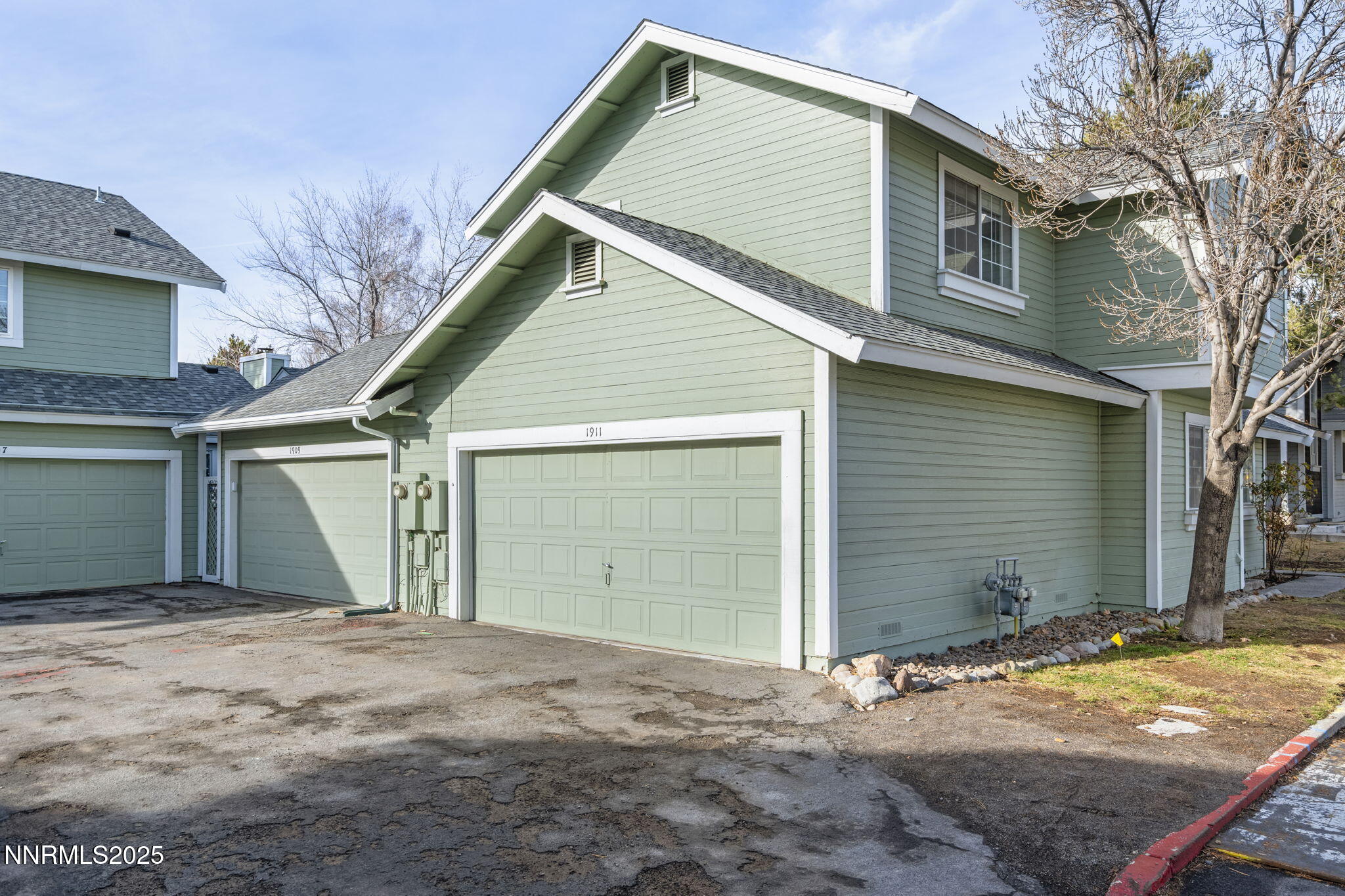 1911 East Minaret Circle Reno, NV 89523 - Photo 21 of 27 a view of a house with a yard and garage