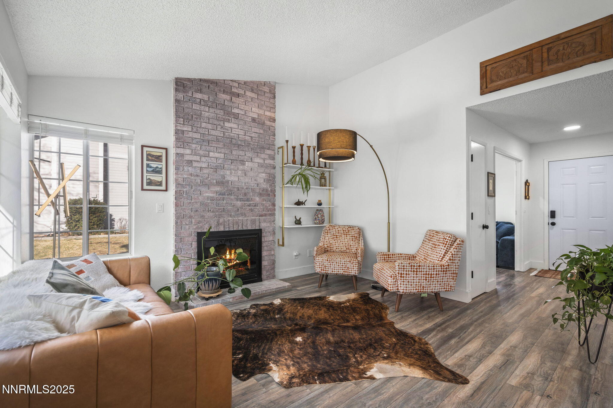 1911 East Minaret Circle Reno, NV 89523 - Photo 5 of 27 a living room with furniture fireplace and window
