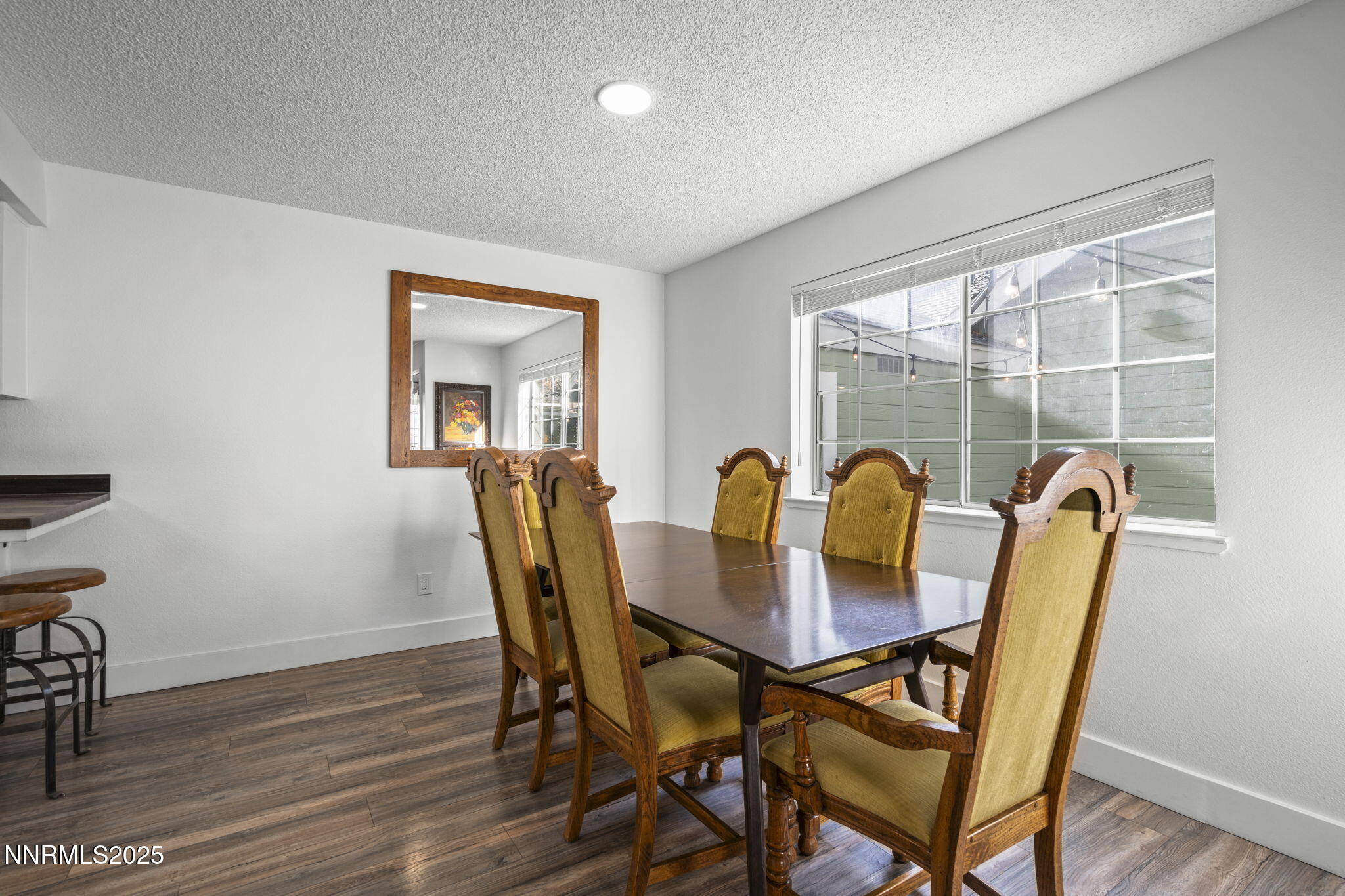 1911 East Minaret Circle Reno, NV 89523 - Photo 7 of 27 a view of a dining room with furniture and wooden floor