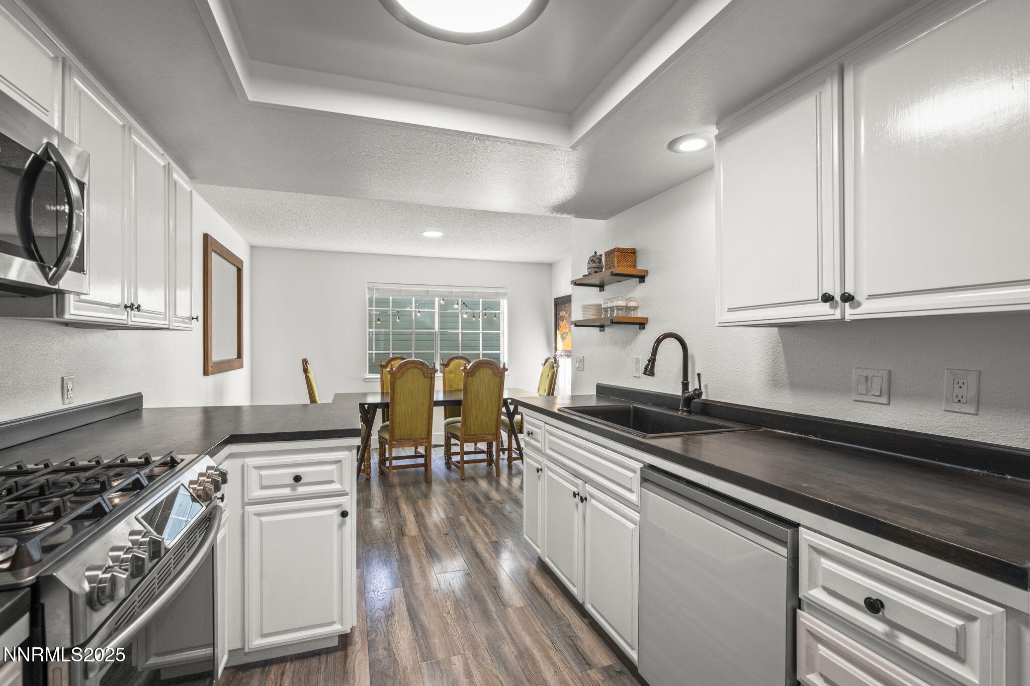 1911 East Minaret Circle Reno, NV 89523 - Photo 9 of 27 a kitchen with granite countertop a sink appliances cabinets and a counter top space