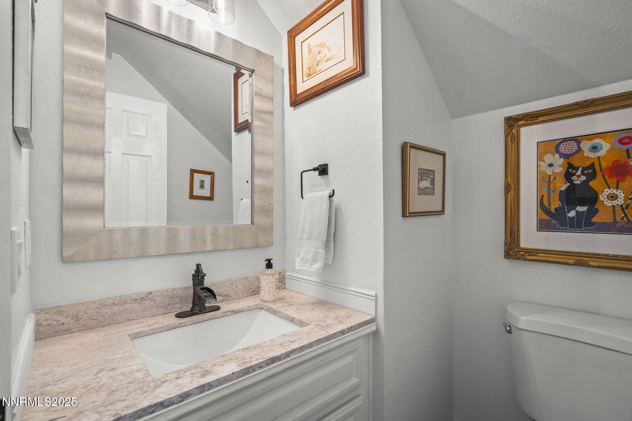 1911 East Minaret Circle Reno, NV 89523 - Photo 10 of 27 a bathroom with a granite countertop sink and a mirror