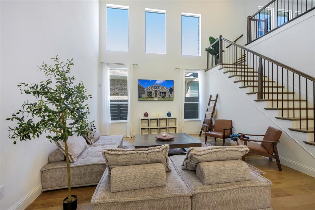 3603 Scotsman Road Sachse, TX 75048 - Photo 2 of 33 a living room with furniture flower pot and a potted plant