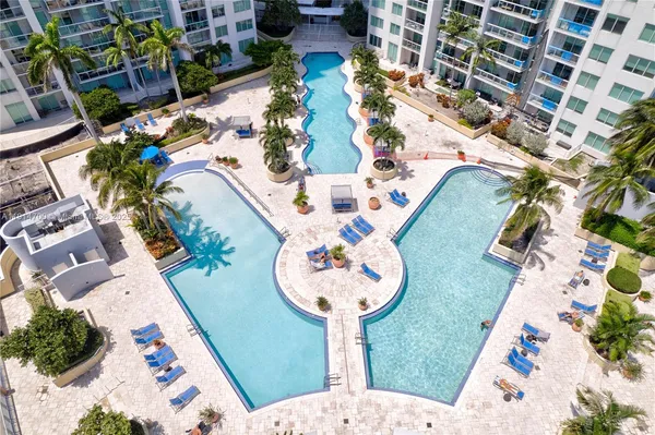 an aerial view of a house with a swimming pool