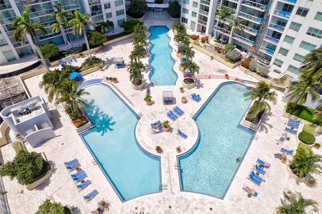 an aerial view of a house with a swimming pool