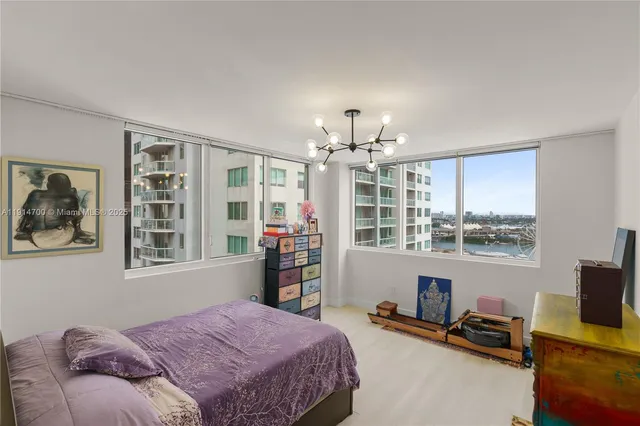 a bedroom with a bed furniture and a window