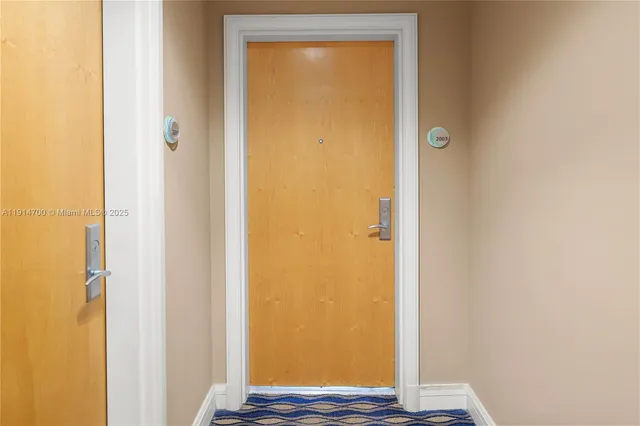 a view of front door with wooden floor