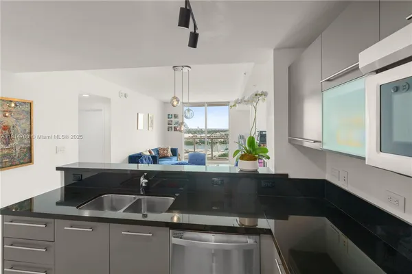 a kitchen with a sink and a cabinets