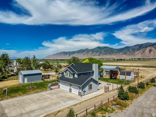 3732 Campbell Road Tooele, UT 84074 - Photo 3 of 69 Contemporary two-story residence featuring a dark gray shingled roof, light gray siding, and a two-car garage
