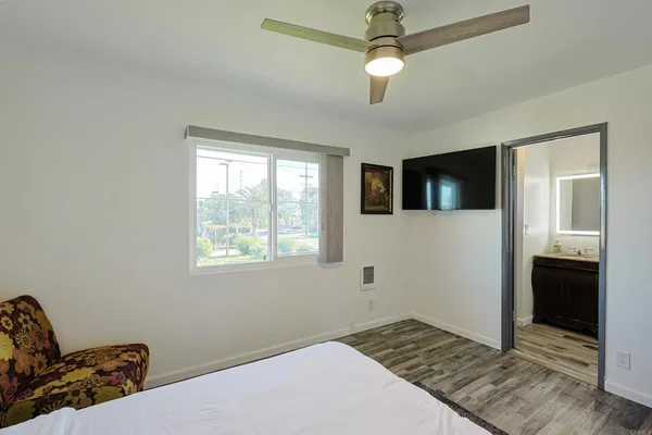 a bedroom with bed and window
