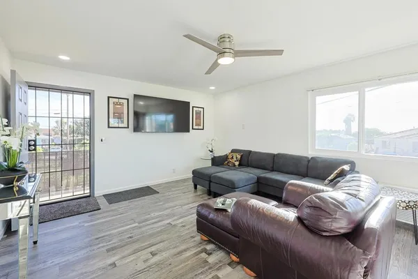 a living room with furniture and a window