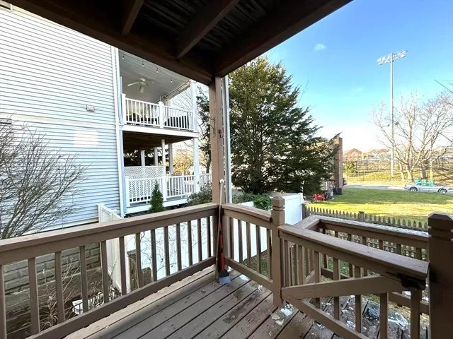 a view of a porch with wooden floor