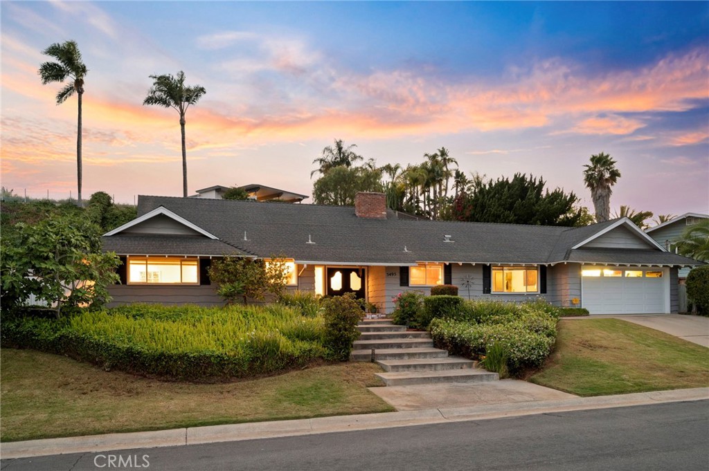 3495 Ridgecrest Drive Carlsbad, CA 92008 - Photo 2 of 42 a view of a large house with a big yard and potted plants