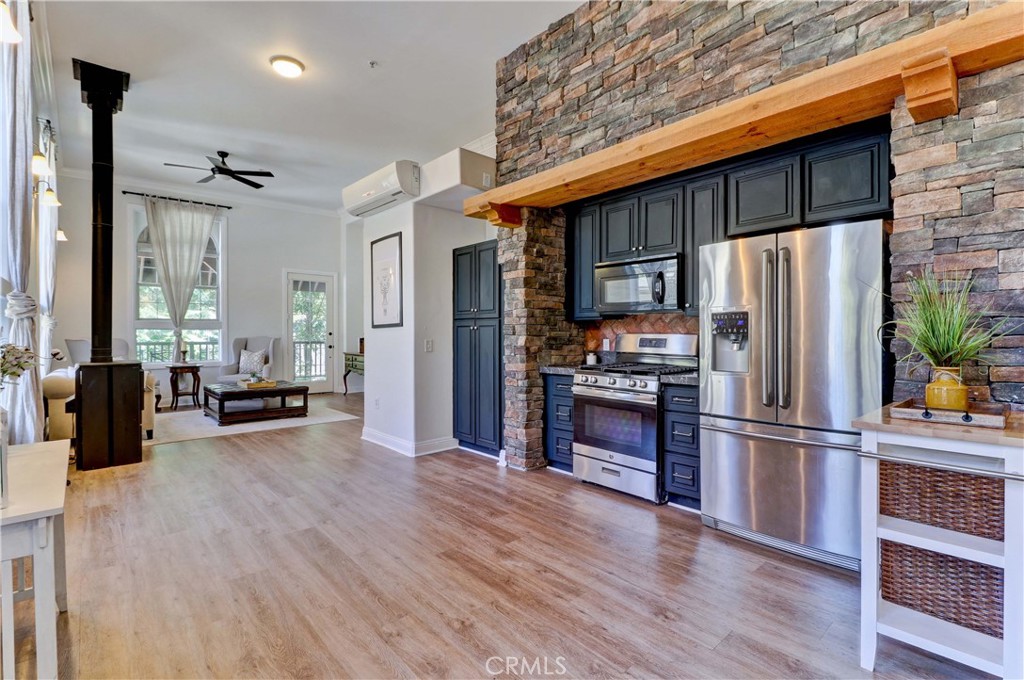 29752 Silverado Canyon Road Silverado, CA 92676 - Photo 1 of 1 a kitchen with stainless steel appliances a refrigerator and wooden floor