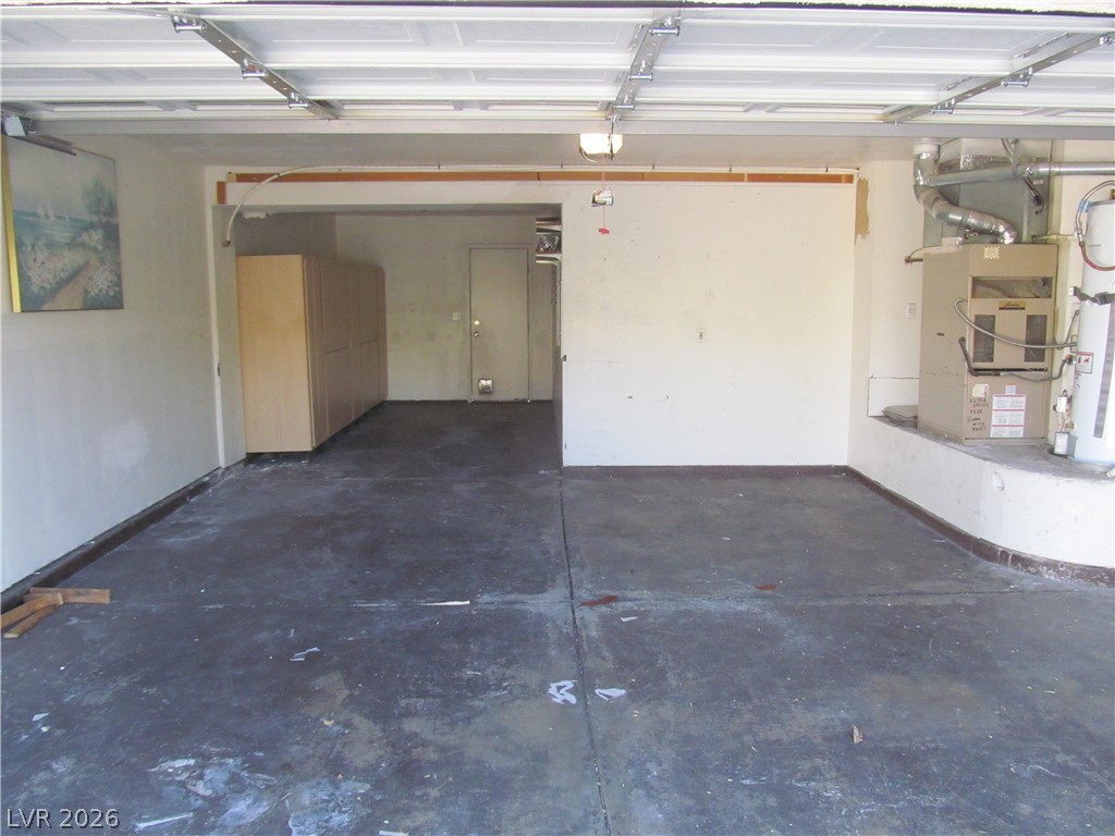 8701 Crescent Ridge Lane Las Vegas, NV 89134 - Photo 24 of 28 A spacious, clean garage offers convenient storage and direct home access.