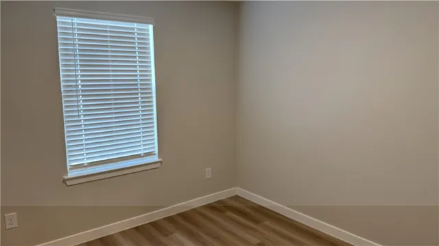 a view of front door with wooden floor