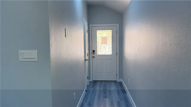 a view of a room that has a window in it