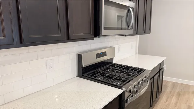a close view of a sink and dishwasher in a kitchen