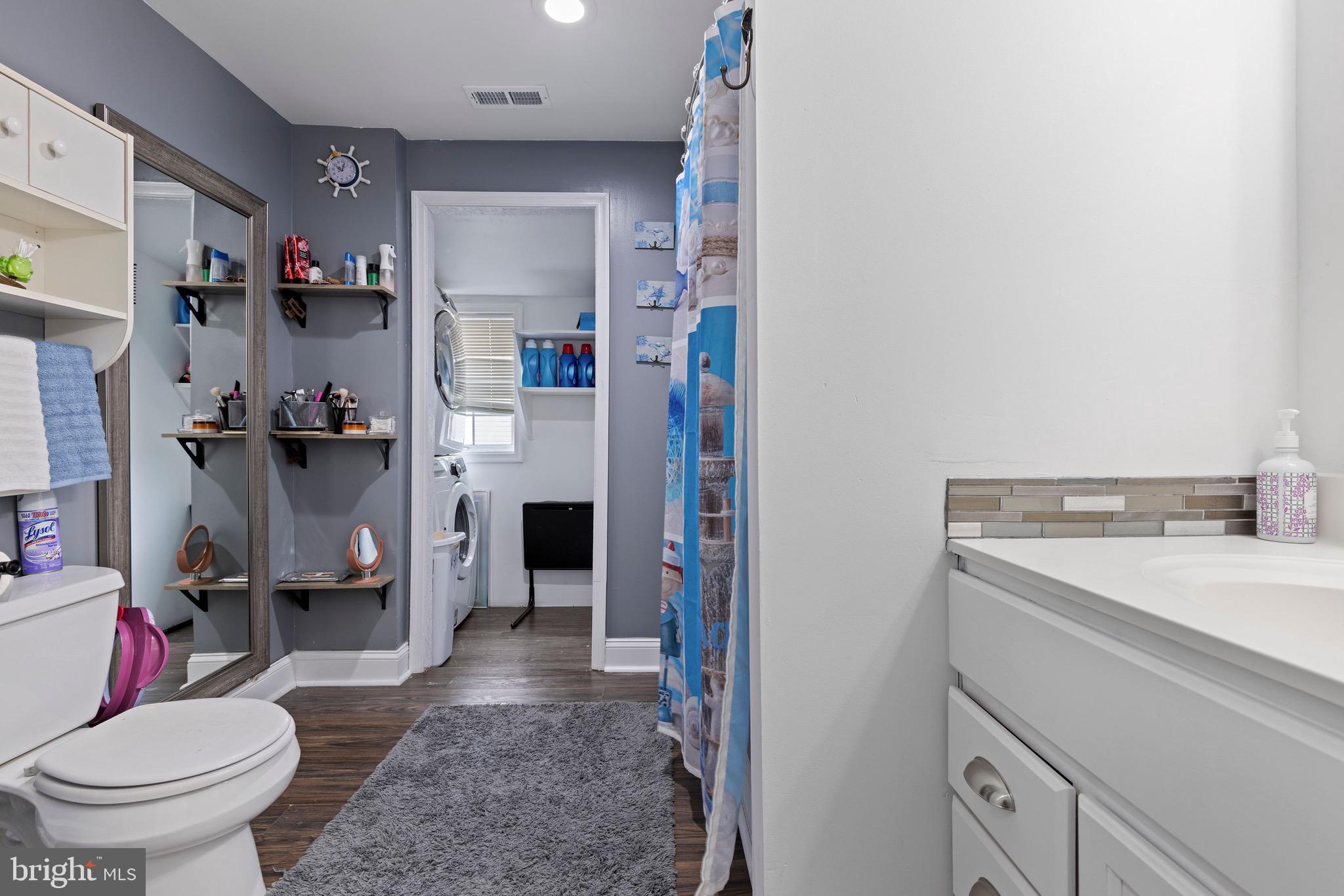 3512 Wagon Train Road Middle River, MD 21220 - Photo 20 of 27 a bathroom with a sink toilet and shower