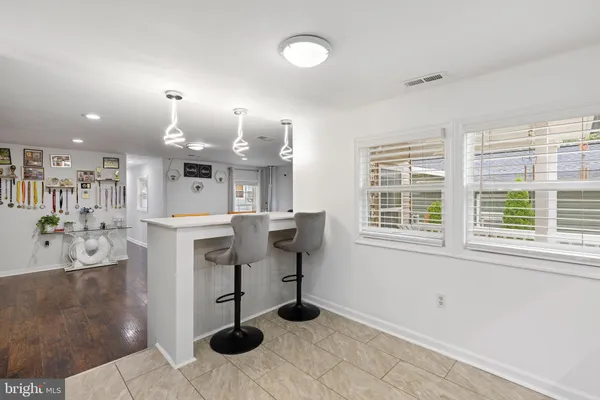 a kitchen with refrigerator and window