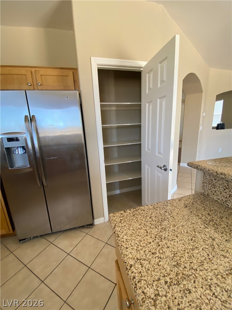 489 Foster Springs Road Las Vegas, NV 89148 - Photo 6 of 30 Ample storage space with built-in pantry shelving and durable tile flooring.