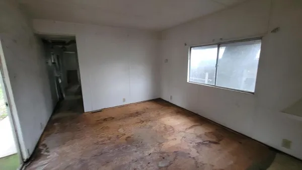 an empty room with windows