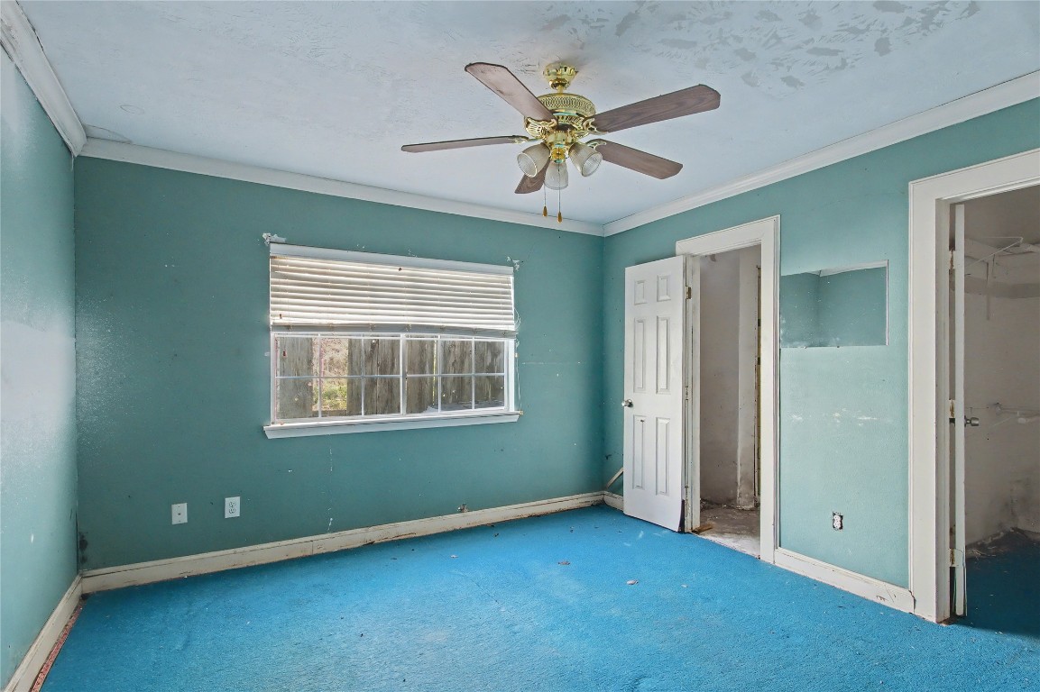4407 Mowery Road Houston, TX 77047 - Photo 11 of 19 an empty room with fan and windows