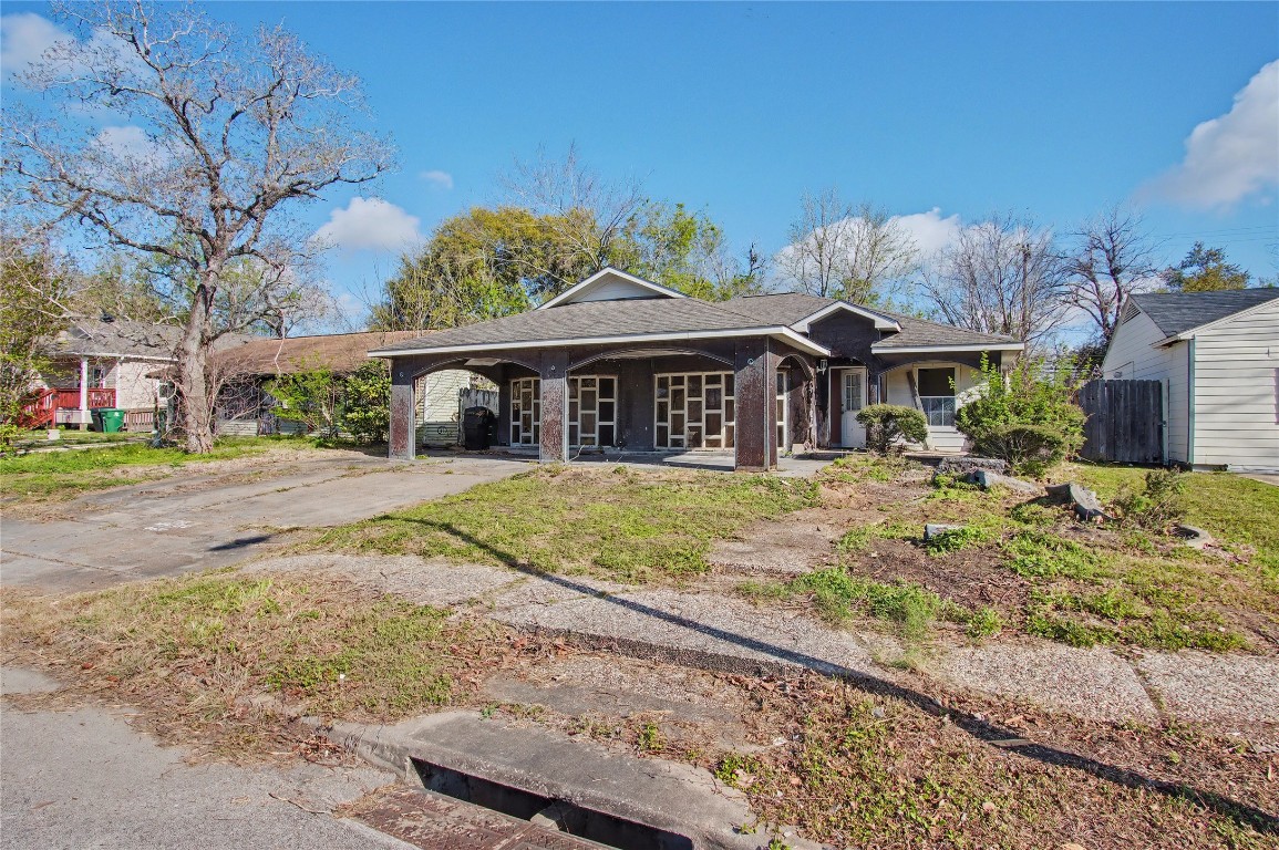 4407 Mowery Road Houston, TX 77047 - Photo 18 of 19 a front view of a house with a yard