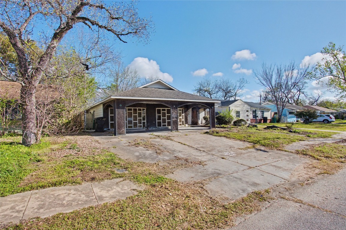 4407 Mowery Road Houston, TX 77047 - Photo 19 of 19 a front view of a house with a yard and garage