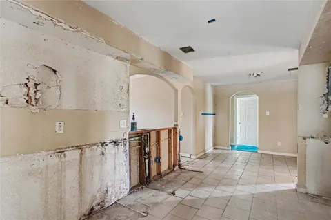 a view of a hallway with entryway windows and entryway