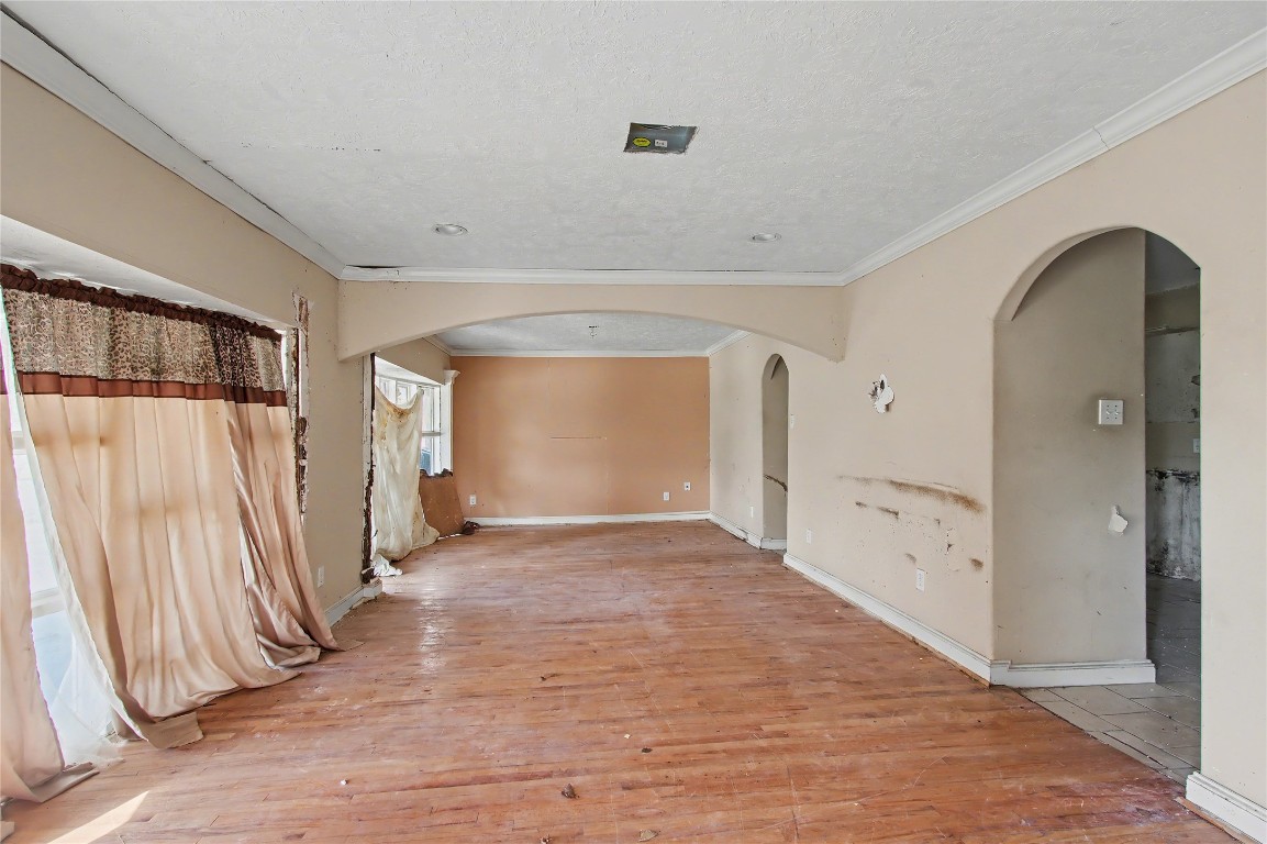 4407 Mowery Road Houston, TX 77047 - Photo 5 of 19 a view of a hallway with wooden floor and entryway