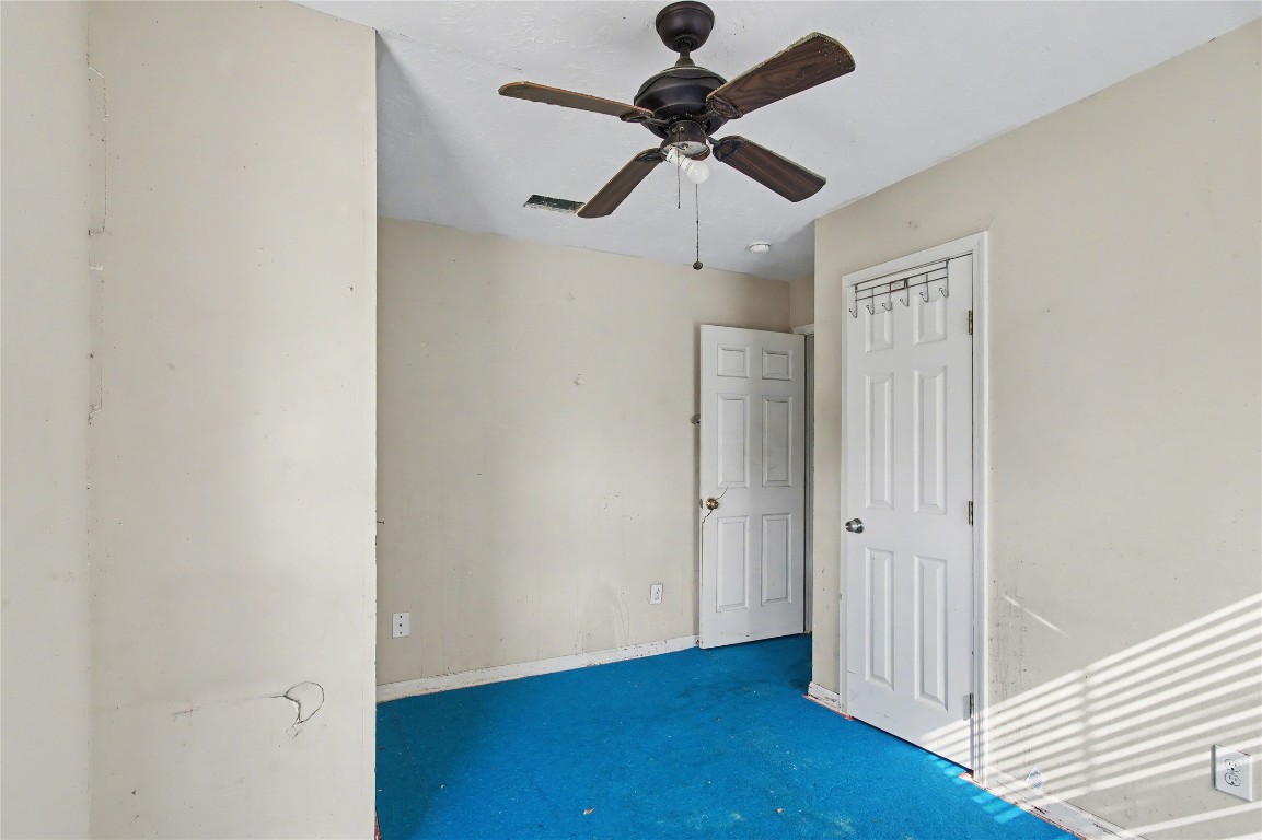 4407 Mowery Road Houston, TX 77047 - Photo 8 of 19 a view of a hallway with wooden floor
