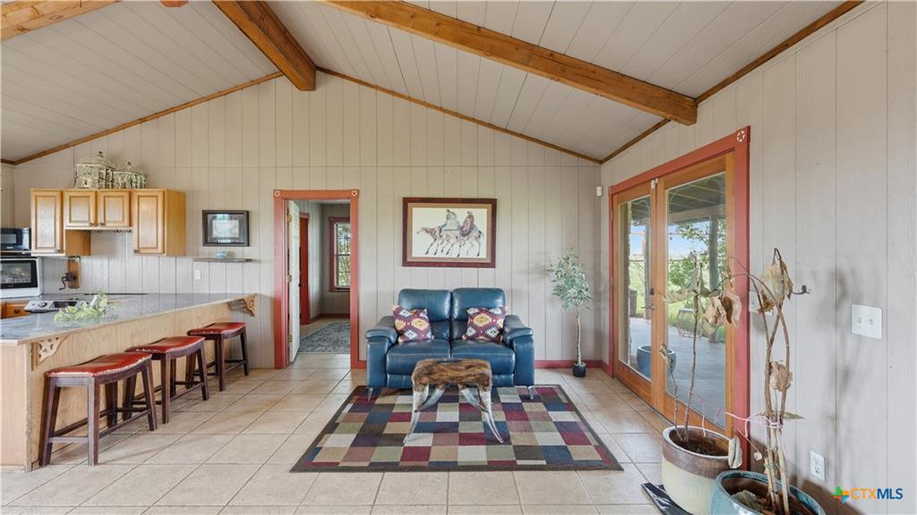 127 Offer Llano, TX 78643 - Photo 14 of 40 Vaulted ceiling with exposed wood beams