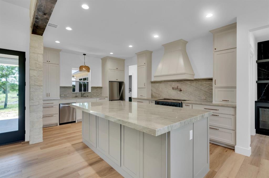 Tbd Hampel Road Palmer, TX 75152 - Photo 29 of 34 a kitchen with white cabinets sink and stove