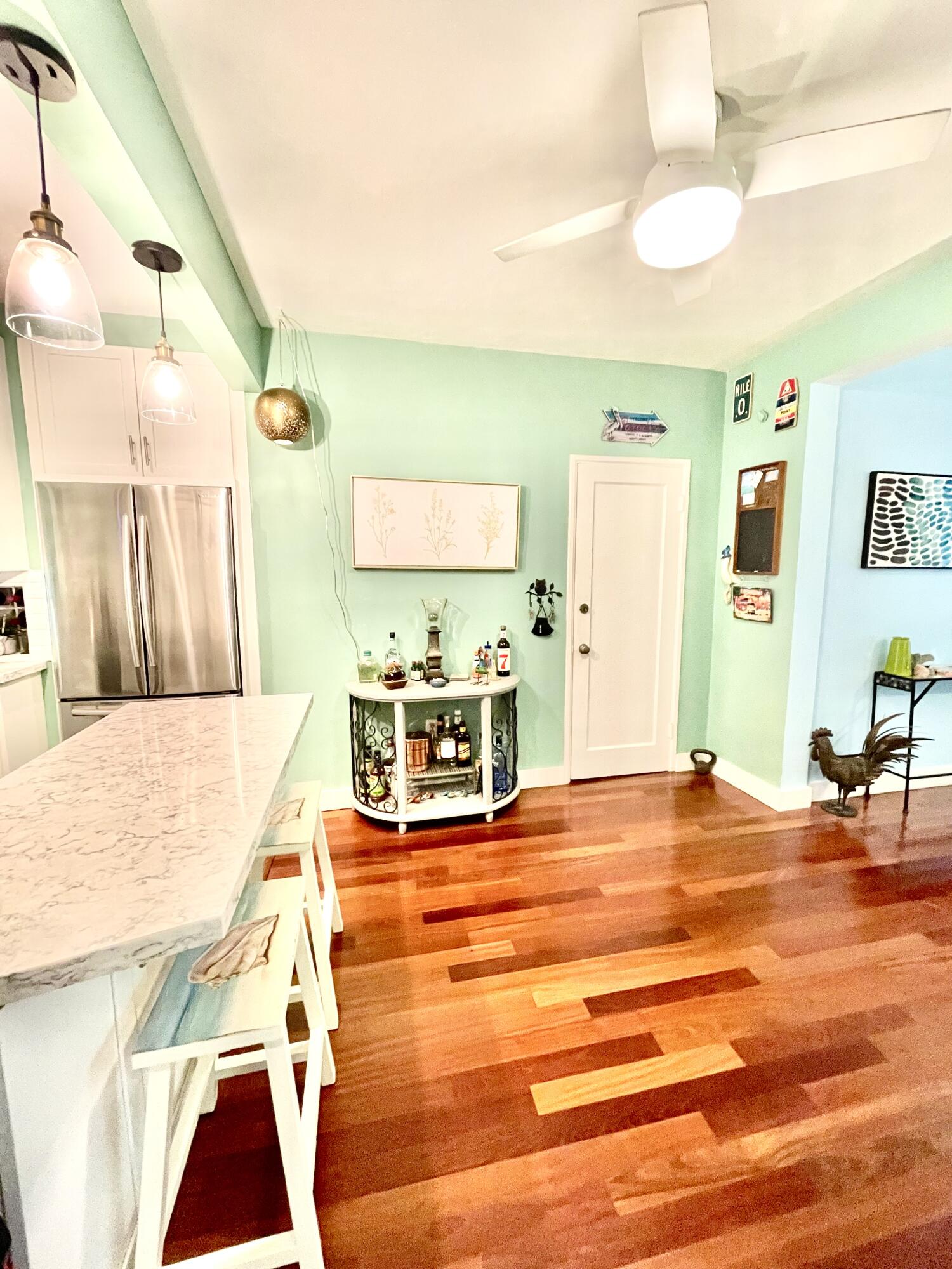 804 South Street, Unit 1 Key West, FL 33040 - Photo 13 of 31 a view of a kitchen with furniture and wooden floor