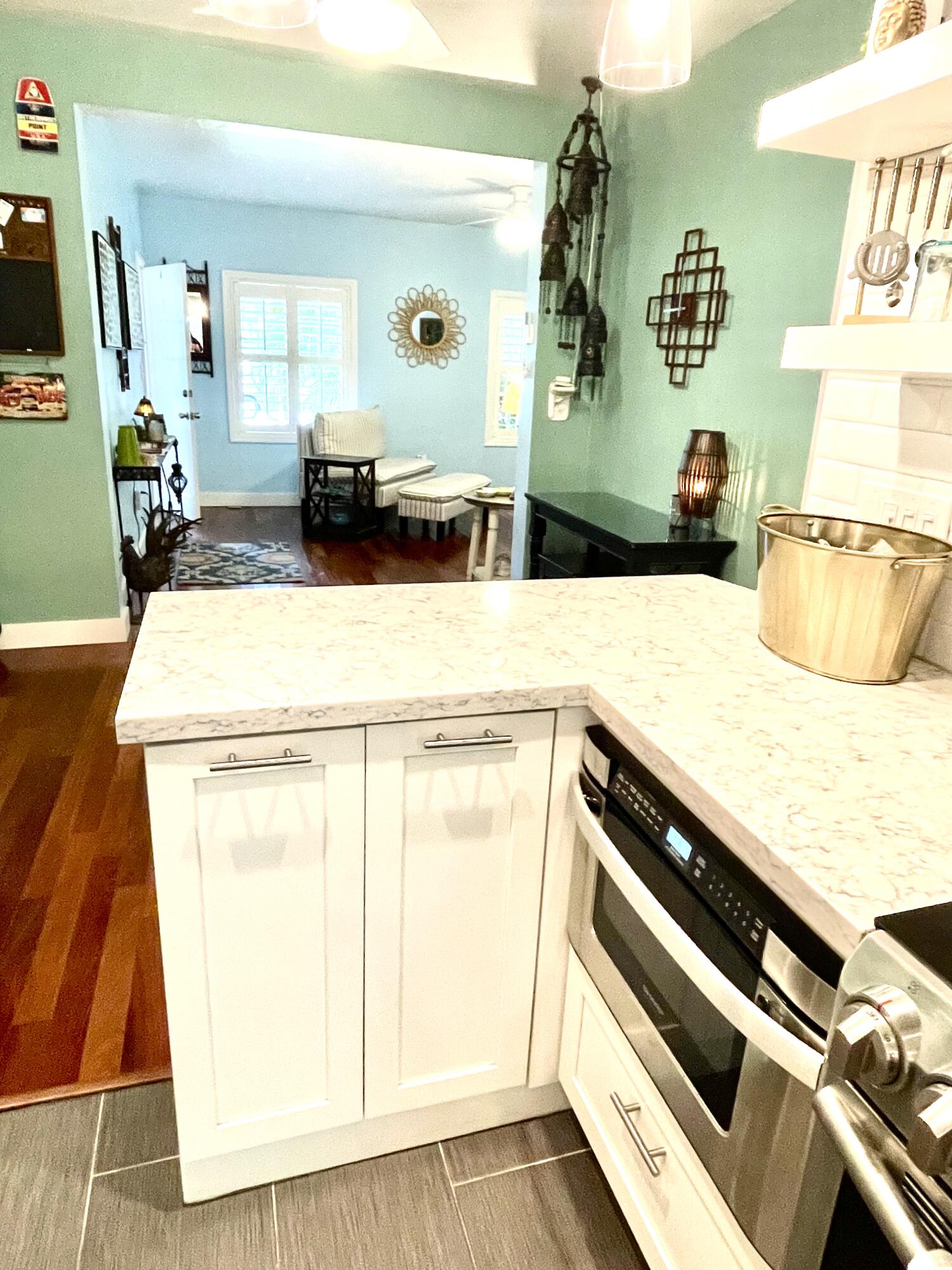 804 South Street, Unit 1 Key West, FL 33040 - Photo 18 of 31 a bedroom with a bed and wooden floor