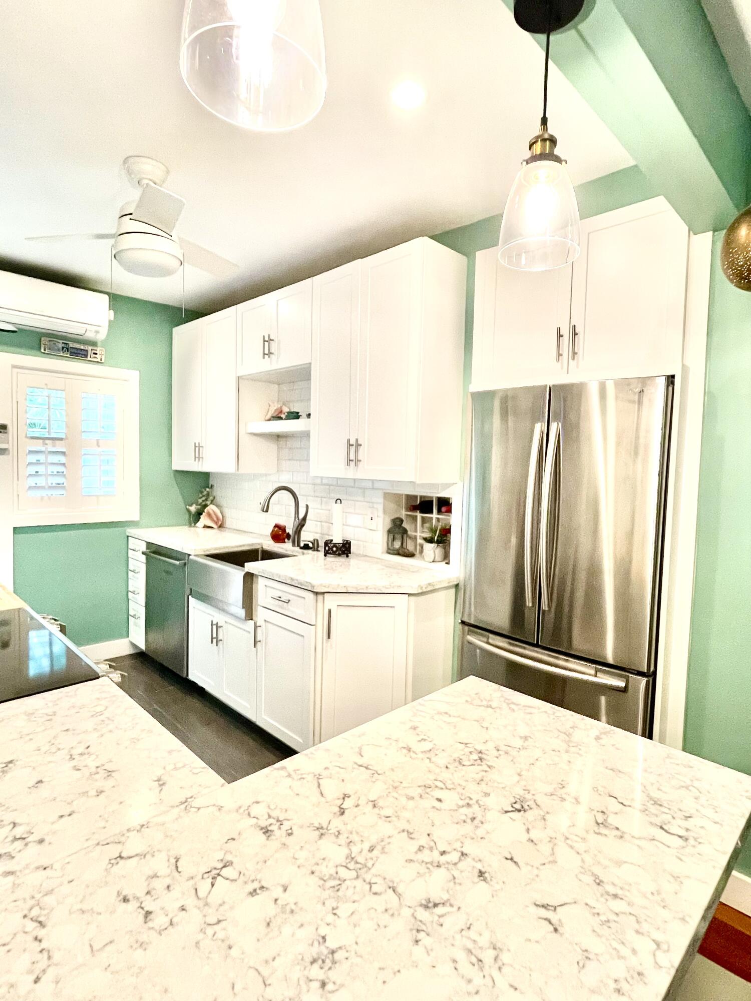 804 South Street, Unit 1 Key West, FL 33040 - Photo 20 of 31 a kitchen with a refrigerator sink and cabinets