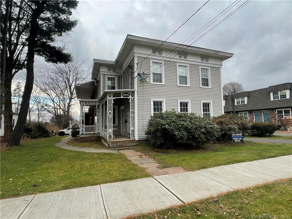 324 Main Street, Unit 3 Portland, CT 06480 - Photo 1 of 16 a view of a building with a yard