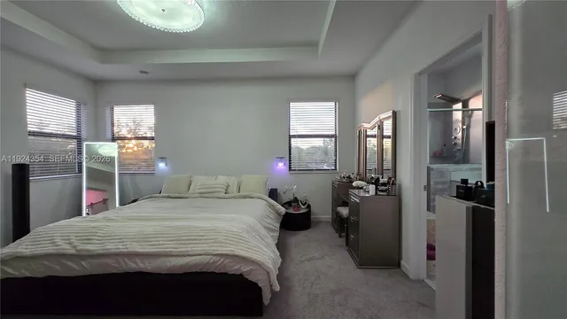 a bedroom with a bed and a mirror