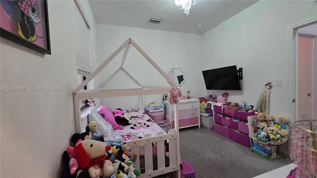 a bathroom with a sink vanity mirror and toilet
